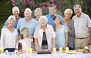 Large Family Group Celebrating Birthday Outdoors photo