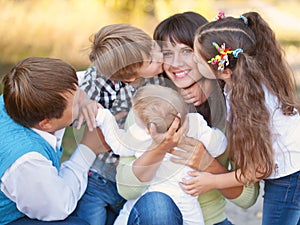 Large family hugging and having fun outdoors