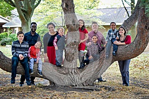 Large Family by Tree