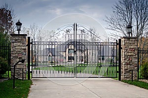 Large fancy mansion behind a gated entry