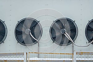 Large fans on the wall of the building