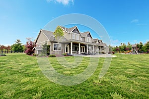 Large farm country house with spring green landscape. photo
