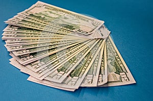 Large Fat Money Roll Isolated on a blue Background