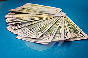 Large Fat Money Roll Isolated on a blue Background