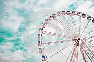 Large ferris wheel on a blue sky background