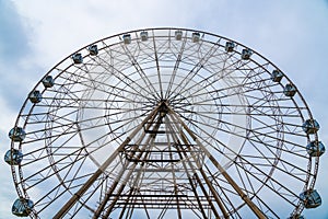 a large Ferris wheel on a blue sky background