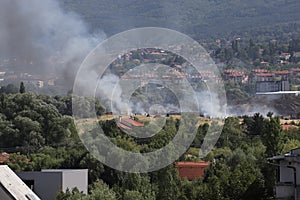 A large fire is burning from burning stubble in Sofia, Bulgaria on August, 3, 2021. The fire is burning the forest, field, houses