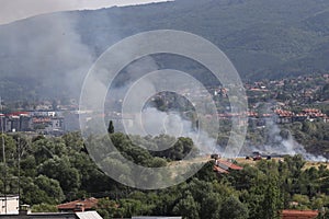 A large fire is burning from burning stubble in Sofia, Bulgaria on August, 3, 2021. The fire is burning the forest, field, houses