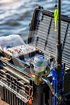 A large fisherman`s tackle box fully stocked with lures and gear for fishing.fishing lures and accessories in the box background