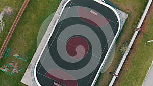 Large football field with special dark green covering aerial