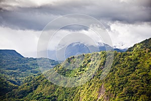 Large forest mountain valley. The tops of the mountains are covered with rainforest. Mountain landscape, nature of the Philippines