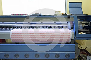 Large format inkjet printer working on sticker sheets