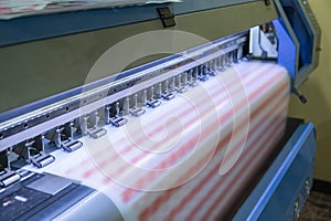 Large format inkjet printer working on sticker sheets