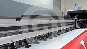 Large format inkjet printing press in operation. Working large format printer. Riding carriage with paint. 4k