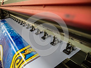 Large format printing machine in operation.