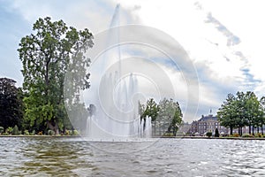 The large fountain during a beautiful but windy day in the gardens of Paleis het Loo in Apeldoorn, Netherlands