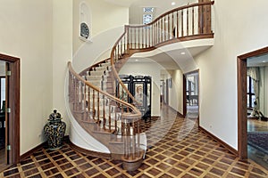 Large foyer with circular staircase