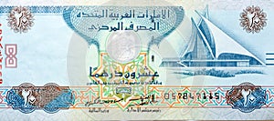 Large fragment of obverse side of 20 AED twenty Dirhams banknote of United Arab Emirates that features the image of Dubai creek photo