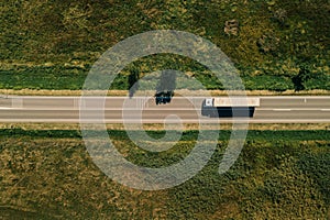 Large freight transporter semi-truck on the road, aerial view