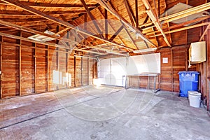 Large garage with concrete floor.