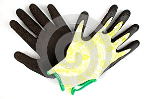 Large garden gloves. Green and black rubberized gloves. Isolate. Flat lay