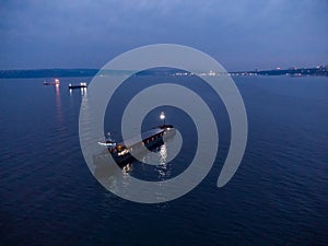 Large general cargo ship tanker bulk carrier, aerial view at night