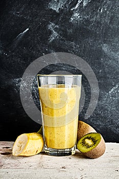Large glass of kiwi and banana smoothie