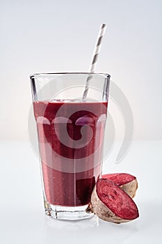 Large glass of nutritious root vegetable drink