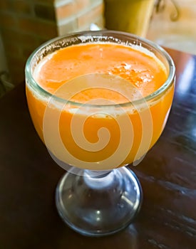 A large glass of orange juice