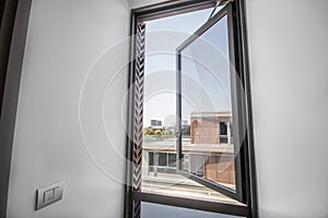 Large glass windows with aluminum frames in the room