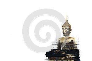 A large golden Buddha image undergoing renovations located outdoors in a Thai temple.  Isolated white background.