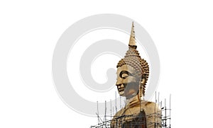 A large golden Buddha image undergoing renovations located outdoors in a Thai temple.  Isolated white background