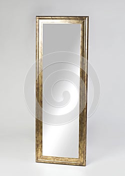 Large golden framed mirror isolated on white background