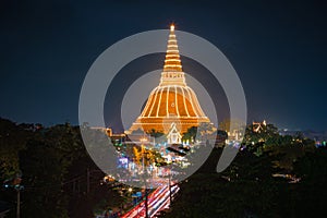 Large golden pagoda Located in the community at sunset , Phra Pathom Chedi , Nakhon Pathom province, Thailand. This is  public