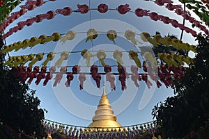 The large golden pagoda is Phra That Hariphunchai .