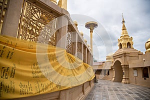 Large golden temple with sky background, Name is Phra Maha Chedi Srivang Chai, Located in Lamphun, Thailand.