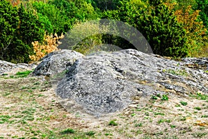 Large granite cliffs covered with old moss are an inherent part of the harsh northern landscape of Sweden, Granna photo