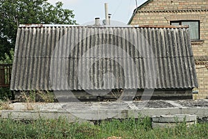 Large gray slate roof of an old rural house