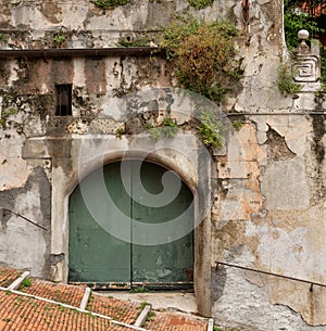 Large green arched doors