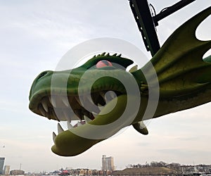 Large green dragon with teeth in Baltimore inner harbor