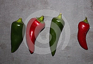 Large Green & Red Chili`s On A Slate Background