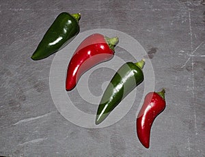 Large Green & Red Chili`s On A Slate Background