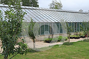 A large greenhouse in the kitchen garden of an English country house