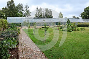 A large greenhouse in the kitchen garden of an English country house