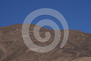 Petroglyphs at Cerro Pintados, Atacama Desert, Chile photo