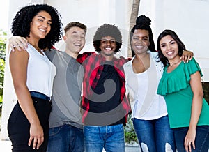 Large group of brazilian young adults arm in arm