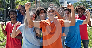 Large group of cheering young man and woman