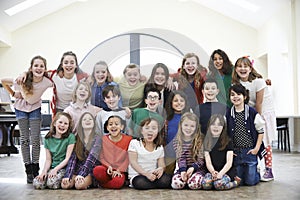 Large Group Of Children Enjoying Drama Workshop Together photo