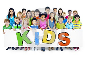 Large Group of Children Holding Board Kids Concept