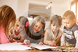 Large group of children lying on the floor.